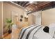 Bedroom featuring modern design, hardwood floors, and an open layout at 1800 Lawrence St # 303, Denver, CO 80202