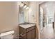 Bathroom with vanity and granite countertop, offering modern fixtures and easy access to other rooms at 844 W 128Th Pl, Westminster, CO 80234
