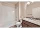 Bathroom with shower-tub combo and vanity with granite countertop, providing modern convenience at 844 W 128Th Pl, Westminster, CO 80234