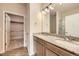 Bathroom with double sink vanity, granite countertop, and glass enclosed shower, offering modern fixtures and ample space at 844 W 128Th Pl, Westminster, CO 80234