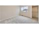 Cozy bedroom filled with natural light, plush carpeting and a window overlooking the outdoors at 844 W 128Th Pl, Westminster, CO 80234
