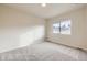 Cozy bedroom featuring plush carpeting and a bright window at 844 W 128Th Pl, Westminster, CO 80234