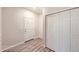 Well-lit entryway with wood-look flooring, a closet, and a neutral paint scheme, creating a welcoming space at 844 W 128Th Pl, Westminster, CO 80234