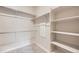 Spacious walk-in closet with shelving and rods, maximizing storage space for an organized wardrobe at 844 W 128Th Pl, Westminster, CO 80234