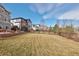 Spacious backyard with lush grass and a wooden fence at 13507 W 87Th Ter, Arvada, CO 80005