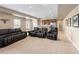 Finished basement featuring a seating area, kitchenette, and neutral carpet at 13507 W 87Th Ter, Arvada, CO 80005