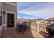 Relaxing outdoor deck features wood decking, a dining table and peaceful neighborhood views at 13507 W 87Th Ter, Arvada, CO 80005