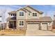 Charming two-story home with a three-car garage and stone accents at 13507 W 87Th Ter, Arvada, CO 80005