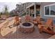 Outdoor fire pit area with Adirondack chairs and brick patio at 13507 W 87Th Ter, Arvada, CO 80005