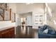 Inviting foyer with hardwood floors, staircase, and stylish decor at 13507 W 87Th Ter, Arvada, CO 80005