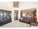 Bright living room featuring soaring ceilings, plush seating, and an open layout with sightlines into the kitchen at 13507 W 87Th Ter, Arvada, CO 80005