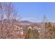 Scenic neighborhood view of houses and flatirons on the horizon at 13507 W 87Th Ter, Arvada, CO 80005