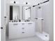 Elegant bathroom featuring a double vanity, modern fixtures, and a walk-in shower at 5770 W 92Nd Ave, Westminster, CO 80031