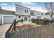 View of backyard with a small patio, garage and fencing, creating a private outdoor space at 19709 Rosewood Ct, Parker, CO 80138