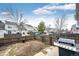 Fenced backyard with a patio, grill, and minimal grass space, perfect for outdoor living at 19709 Rosewood Ct, Parker, CO 80138