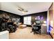Bedroom with dark walls, cozy carpet, ceiling fan and ample desk space at 19709 Rosewood Ct, Parker, CO 80138