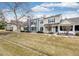 Charming townhouse exterior featuring a well-maintained lawn and varied architectural details at 19709 Rosewood Ct, Parker, CO 80138