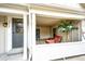 Relaxing front porch with comfortable seating, privacy lattice, and decorative plants at 19709 Rosewood Ct, Parker, CO 80138