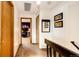 Upstairs hallway featuring neutral walls, cozy carpet, and doorways leading to various rooms at 19709 Rosewood Ct, Parker, CO 80138