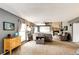 Bright living room boasts a stone fireplace, large windows, and comfortable seating arrangement at 19709 Rosewood Ct, Parker, CO 80138