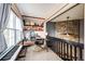 Bright home office space features built in shelving and a large window at 19709 Rosewood Ct, Parker, CO 80138