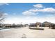 Wide shot of pool grounds with lounge seating and the recreation center at 19709 Rosewood Ct, Parker, CO 80138