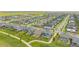 An aerial view featuring many homes in a suburban neighborhood with lush green spaces at 91 S Quantock St, Aurora, CO 80018