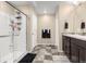 Bathroom features a dual sink vanity and a glass-enclosed shower with white tiling at 91 S Quantock St, Aurora, CO 80018