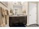 Bathroom with a double sink vanity, stylish fixtures, and neutral color palette at 91 S Quantock St, Aurora, CO 80018