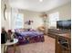 Bright bedroom with carpet, plentiful natural light, and a charming unicorn-themed decor at 91 S Quantock St, Aurora, CO 80018