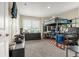 Spacious bedroom featuring a lofted bed, desk, and vibrant decor at 91 S Quantock St, Aurora, CO 80018