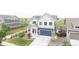 Charming two-story home featuring a covered front porch and a well-maintained front yard at 91 S Quantock St, Aurora, CO 80018