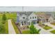 Aerial view of a charming two-story home with solar panels and green lawns at 91 S Quantock St, Aurora, CO 80018