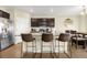 Modern kitchen featuring an island with bar seating and stainless steel appliances at 91 S Quantock St, Aurora, CO 80018