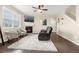 Cozy living room with a fireplace, plush seating, and abundant natural light at 91 S Quantock St, Aurora, CO 80018