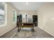 Bright office with a desk, bookshelves, and a large window at 91 S Quantock St, Aurora, CO 80018