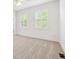 Bedroom featuring shuttered windows, carpet and a ceiling fan, blending style and comfort at 2502 Alton St, Denver, CO 80238