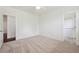 This bedroom includes carpet, a ceiling fan, walk-in closet, and a conveniently located entry door at 2502 Alton St, Denver, CO 80238
