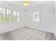 Bright bedroom with three shuttered windows and carpet, ready to create your personal retreat at 2502 Alton St, Denver, CO 80238