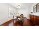 Elegant dining room with a round table, shuttered windows, and stylish decor at 2502 Alton St, Denver, CO 80238