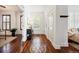 Bright foyer with hardwood floors, decorative inlays, and ample natural light at 2502 Alton St, Denver, CO 80238