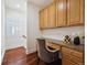 Charming home office with custom built-in desk, drawers, hardwood floors, and bright natural light at 2502 Alton St, Denver, CO 80238