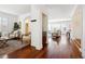 Open-concept living area with hardwood floors, natural light, and stylish furniture at 2502 Alton St, Denver, CO 80238