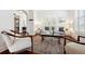 Inviting living room with bright, natural light, plantation shutters and hardwood flooring at 2502 Alton St, Denver, CO 80238
