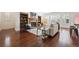 Inviting living room with hardwood floors, fireplace, built-in bookcases, and natural light at 2502 Alton St, Denver, CO 80238