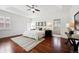 Spacious main bedroom with hardwood floors, ceiling fan, recessed ceiling, and bright natural light at 2502 Alton St, Denver, CO 80238