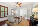 Comfortable home office with neutral colors, large window, and hardwood floors at 2502 Alton St, Denver, CO 80238