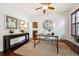 Stylish home office with hardwood floors, neutral decor, and ample workspace at 2502 Alton St, Denver, CO 80238