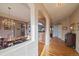 Elegant dining room with hardwood floors, a chandelier, and arched doorways leading to other rooms at 22725 E Long Dr, Aurora, CO 80016