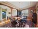 Formal dining room featuring a decorative chandelier, large window, and hardwood floors at 22725 E Long Dr, Aurora, CO 80016